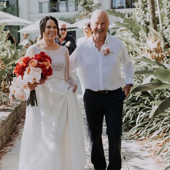 Wedding couple posing at Pullman Palm Cove Sea Temple Resort