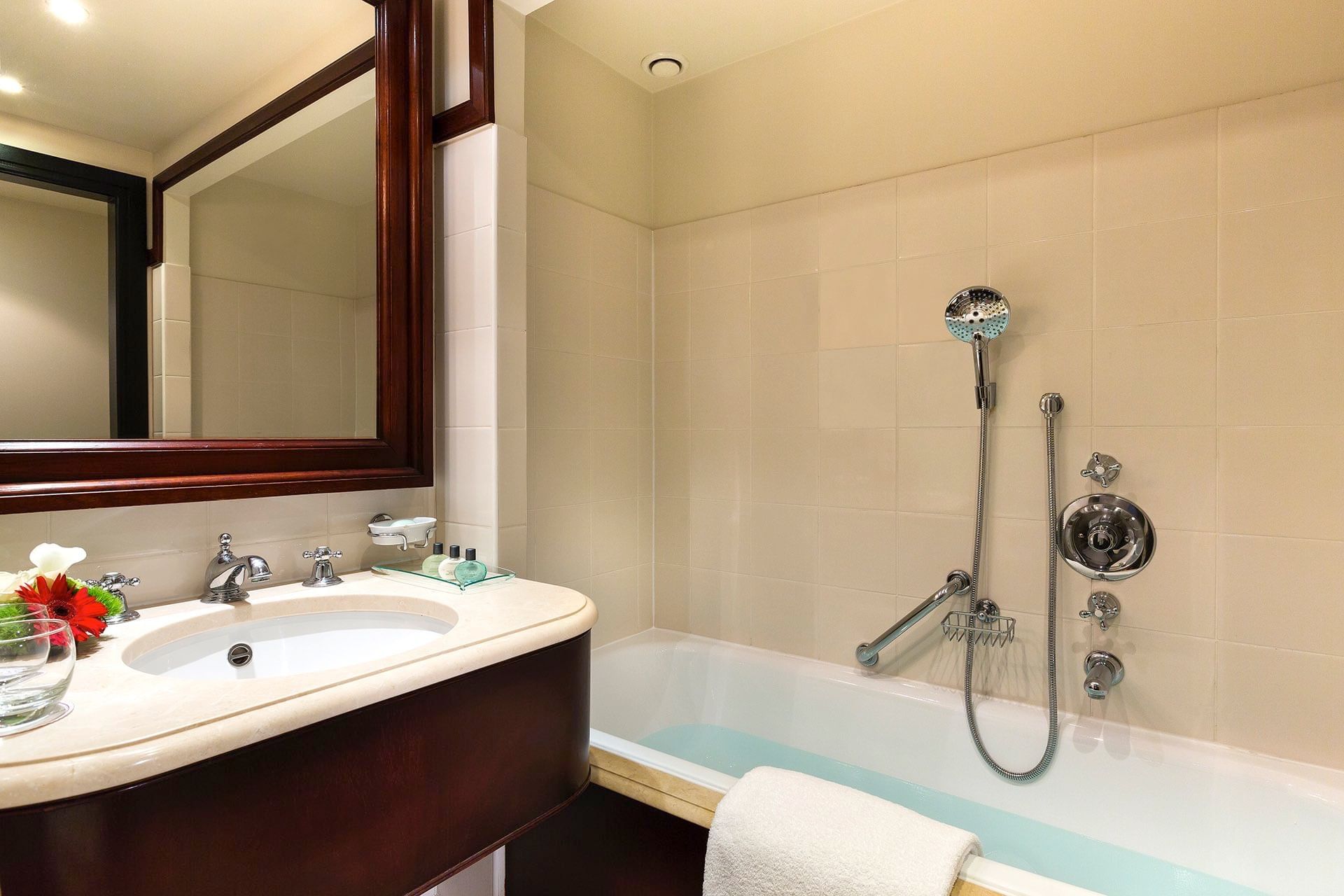 Bathtub with shower in Classic Room at Warwick Hotel Barsey