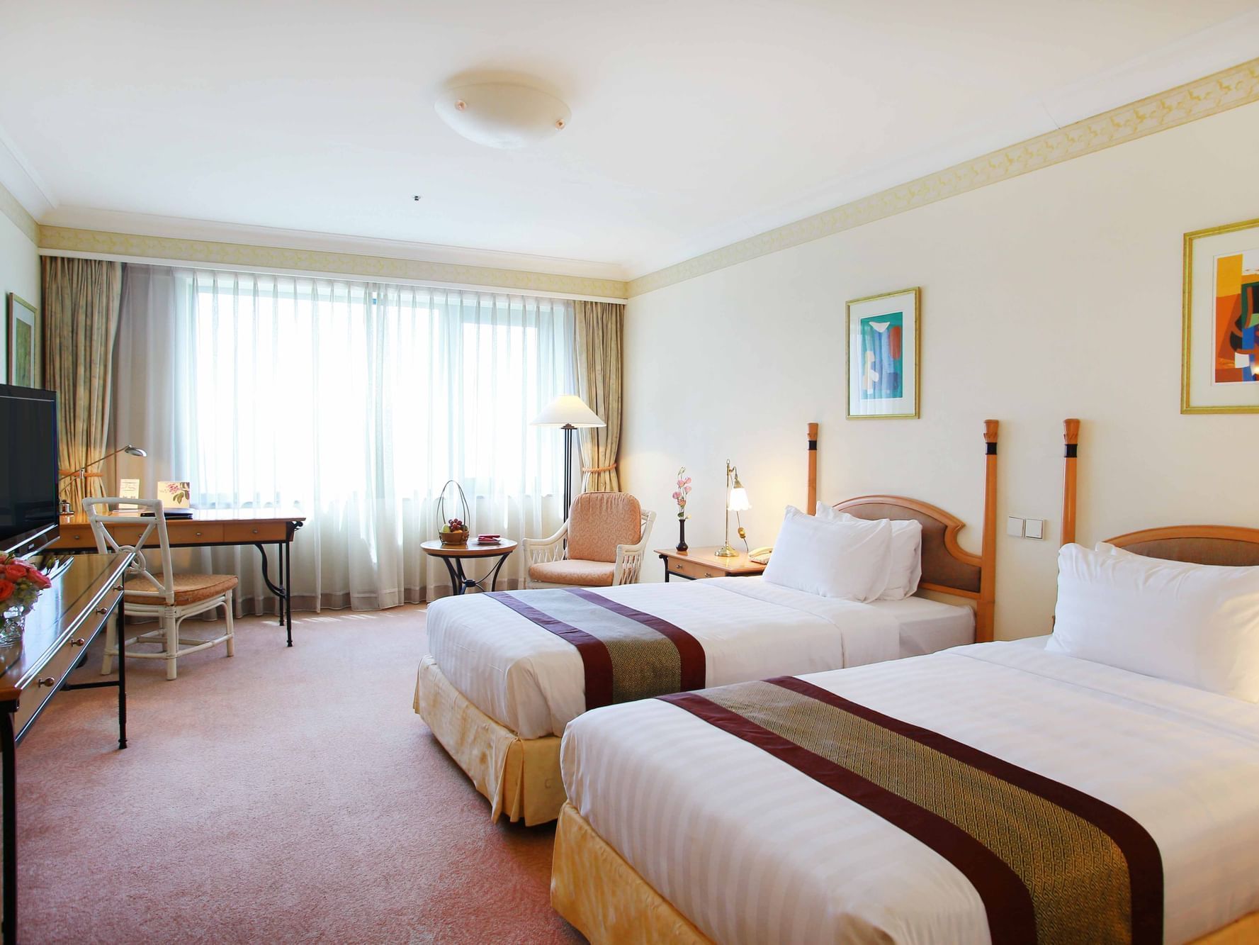 Grand Deluxe Room with two beds & working desk at Hanoi Daewoo Hotel