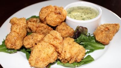 chicken tenders and dipping sauce on plate