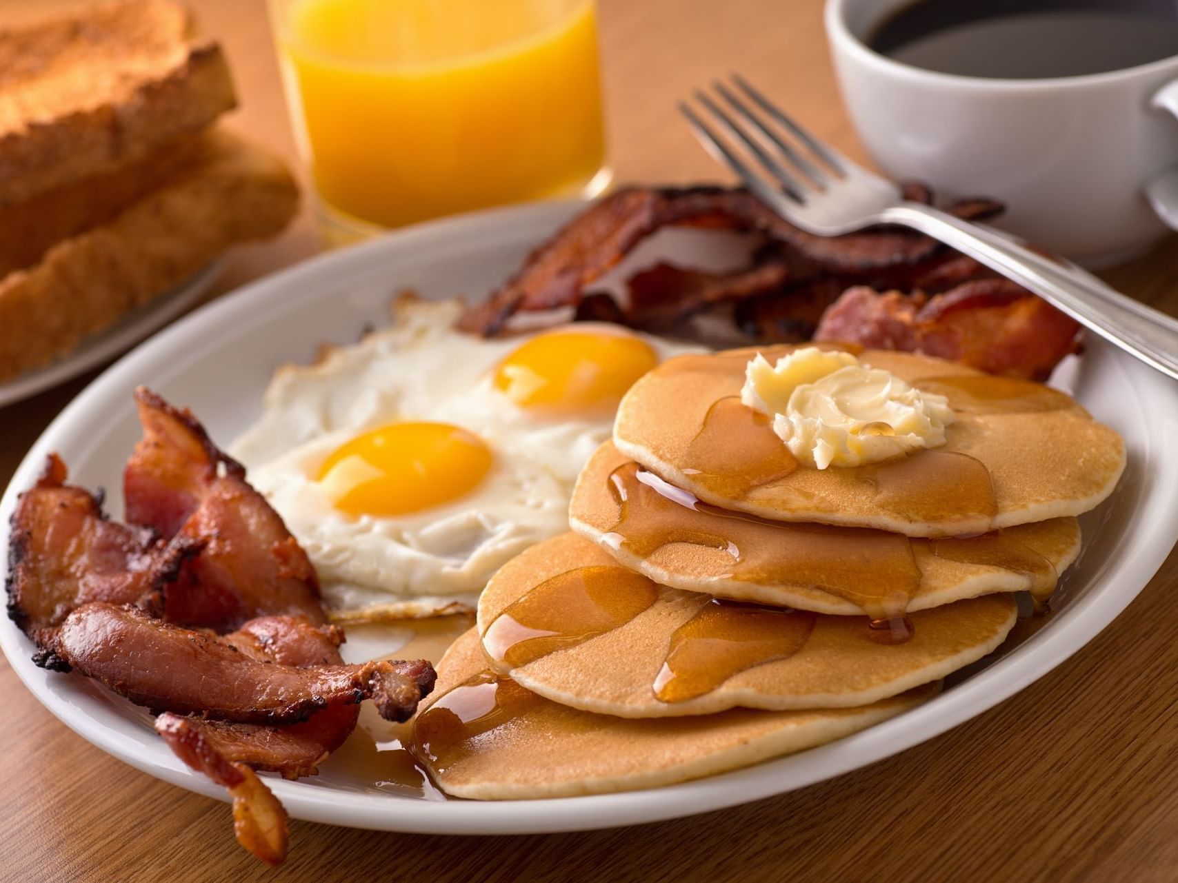 Closeup of Breakfast plates on a table at MCM Eleganté Suites
