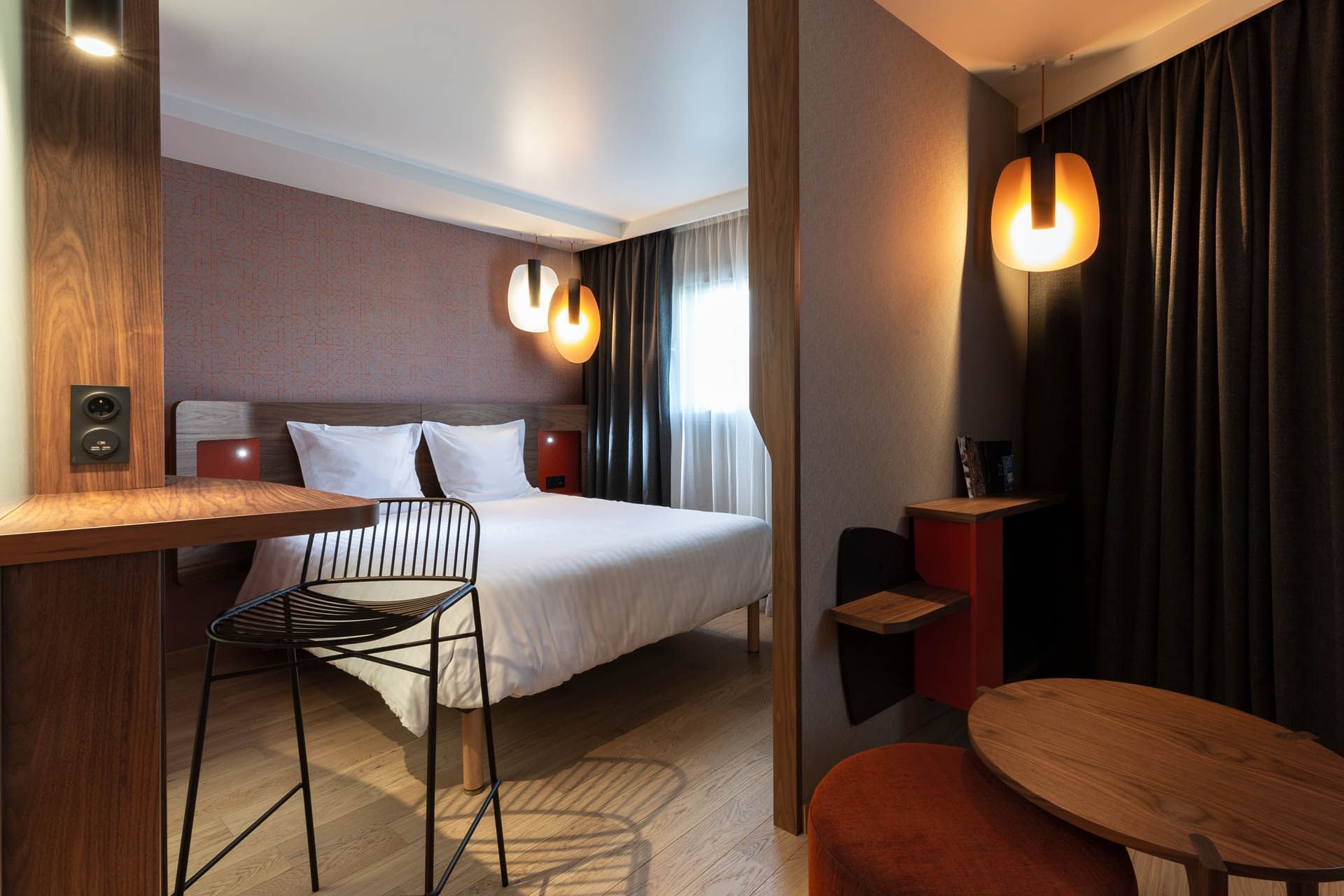 Chambre et salon dans une chambre à l'Oceania Paris Porte de Versailles