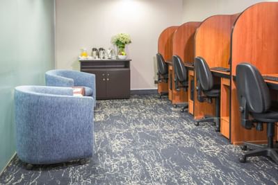 Cozy waiting area and a refreshment station in the Business Center at Hotel Los Delfines & Casino