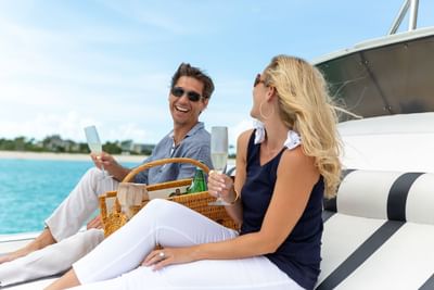 Couple having champagne in the cruise at Somerset Grace Bay