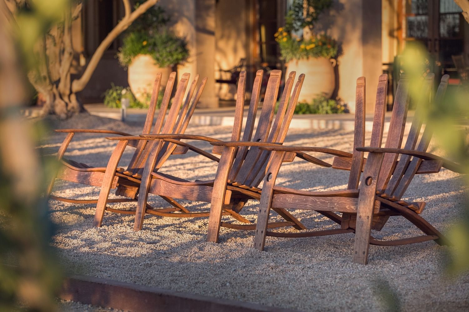 Lorem ipsum Exterior wooden lounge chairs looking at the bocce ball court