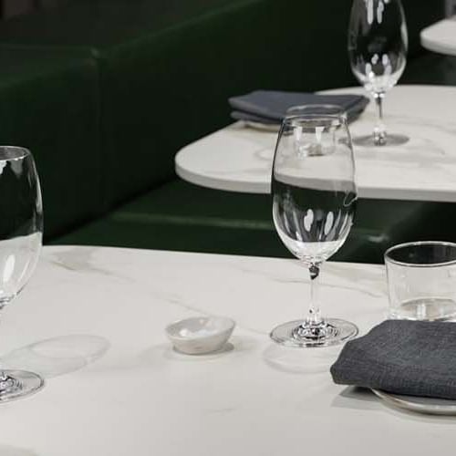 Wine glasses and napkins on a table at Pullman Melbourne CBD