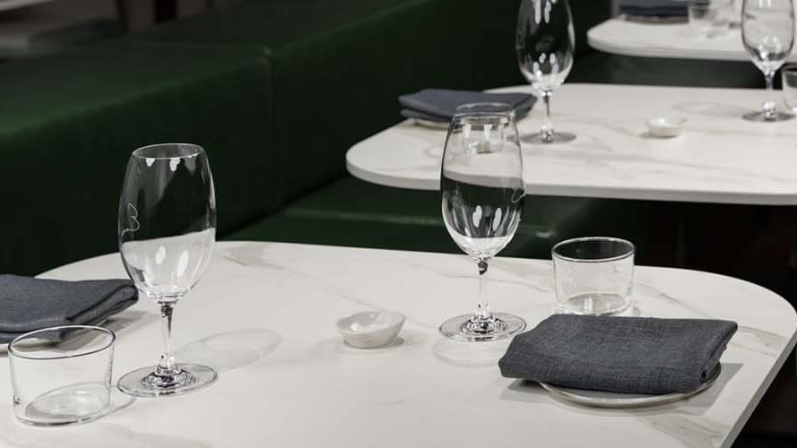 Wine glasses and napkins on a table at Pullman Melbourne CBD