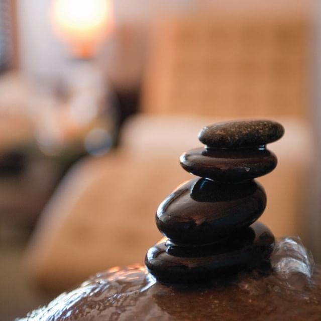 Closeup of Zen basalt stones in spa room at Chase on the Lake