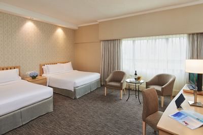 Workspace by the beds in Deluxe Family Room at York Hotel Singapore