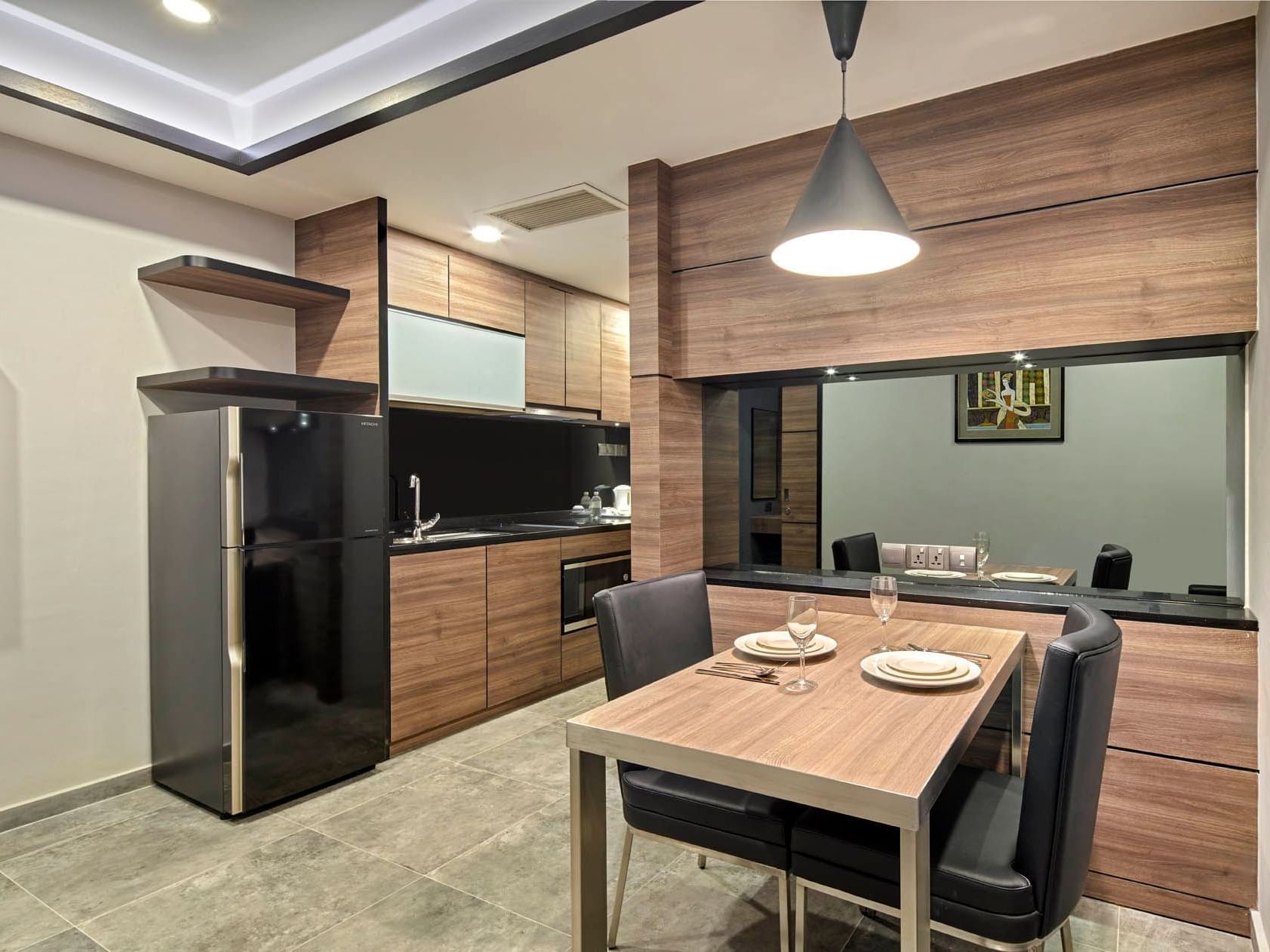 Image 42: One Bedroom kitchen and dining area with wooden cabinetry and stainless steel appliances at Orchard Grand Court