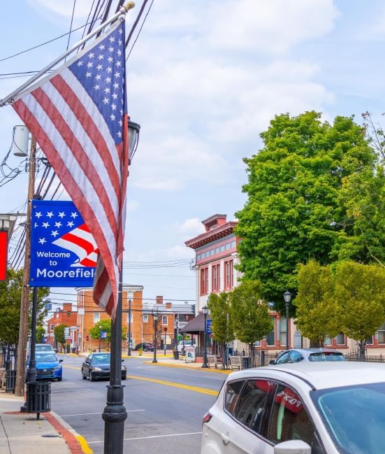 Flag of the United States held on a city street at South Branch Inn Moorefield