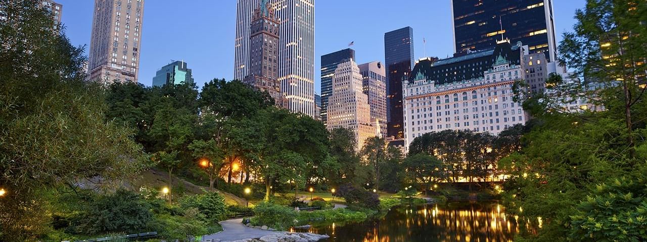 City lights reflect on the river at night in Central Park near Warwick New York