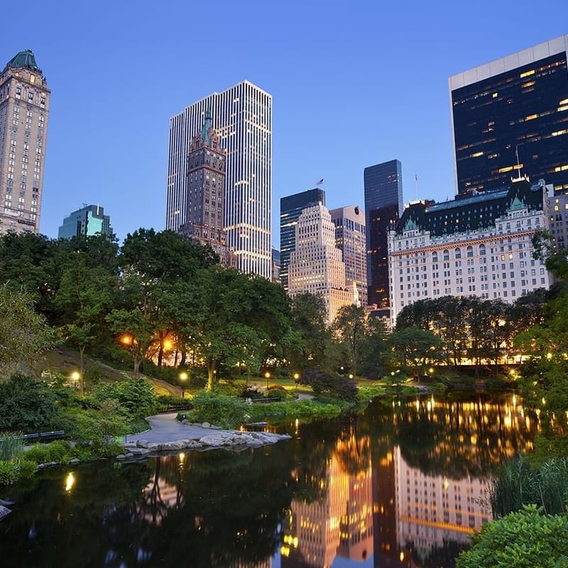 City lights reflect on the river at night in Central Park near Warwick New York