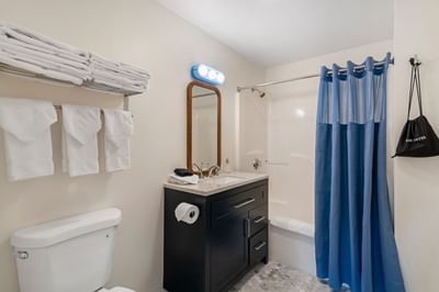 Hotel guest bathroom with shower at Driftaway Hotel and Pool
