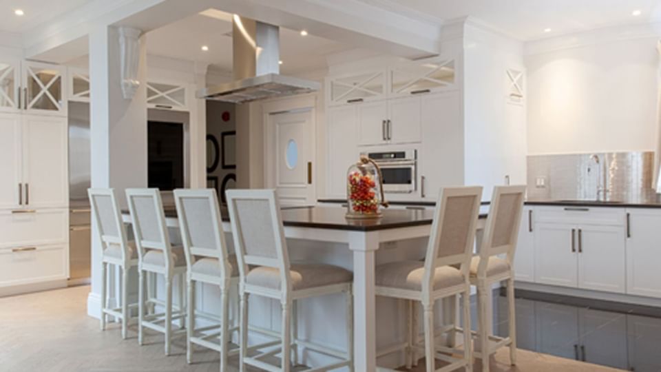 Dining table arranged by the kitchenette area in Royal Suite at Hotel Port Royal