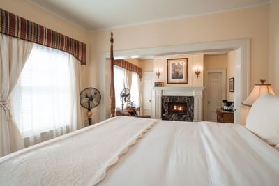 Fireplace & lounger by the bed in Grand Suite, one of the Catalina Island suites at Mt Ada