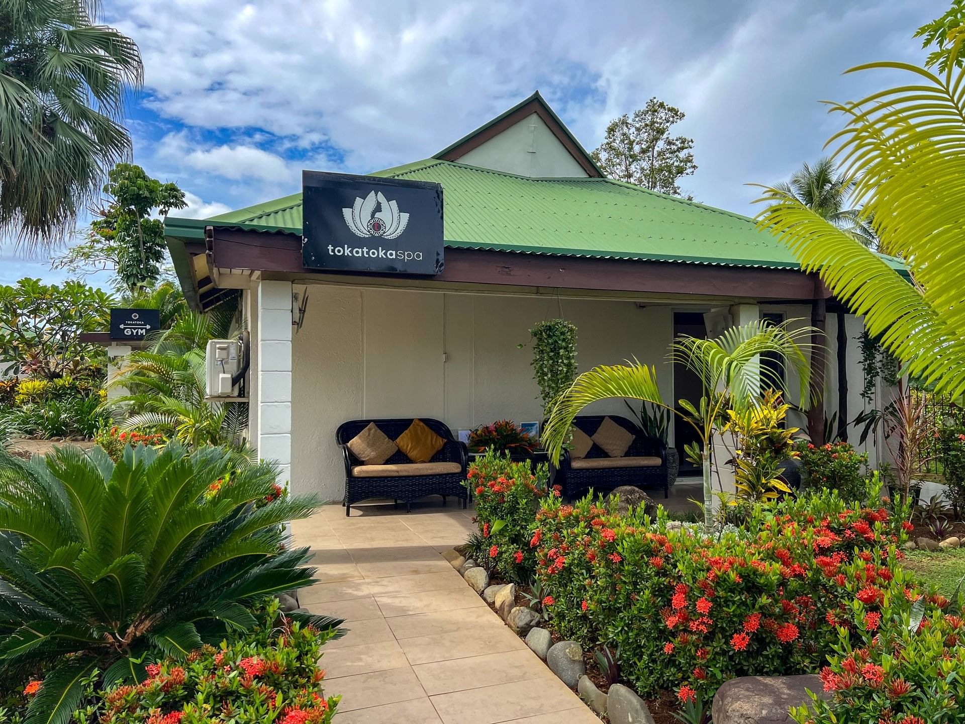 Tropical exterior of Toka Toka Spa building with lush greenery at TokaToka Resort Nadi Fiji نادي