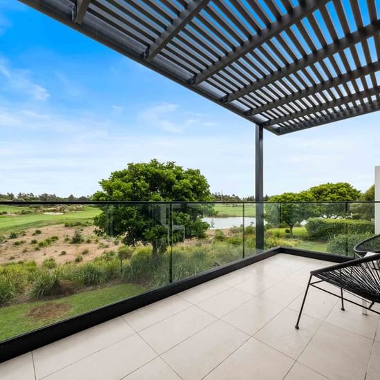 Deluxe Studio Balcony with arranged chairs at Pullman Magenta Shores Resort