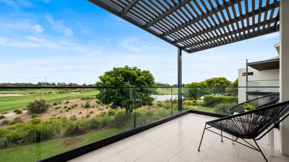 Balcony lounge area in Deluxe Studio Guestroom with a golf course view at Pullman Magenta Shores