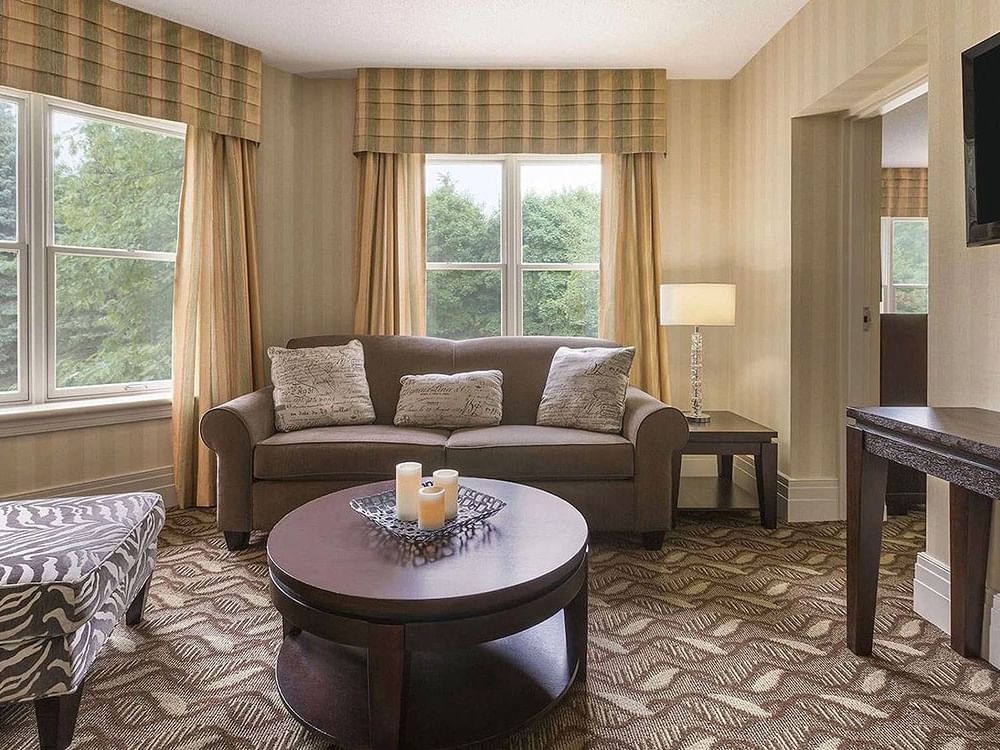 TV lounge by the window in 1 King Bed One Bedroom Executive Suite at Spencer Hotel, offering best hotel suites London Ontario