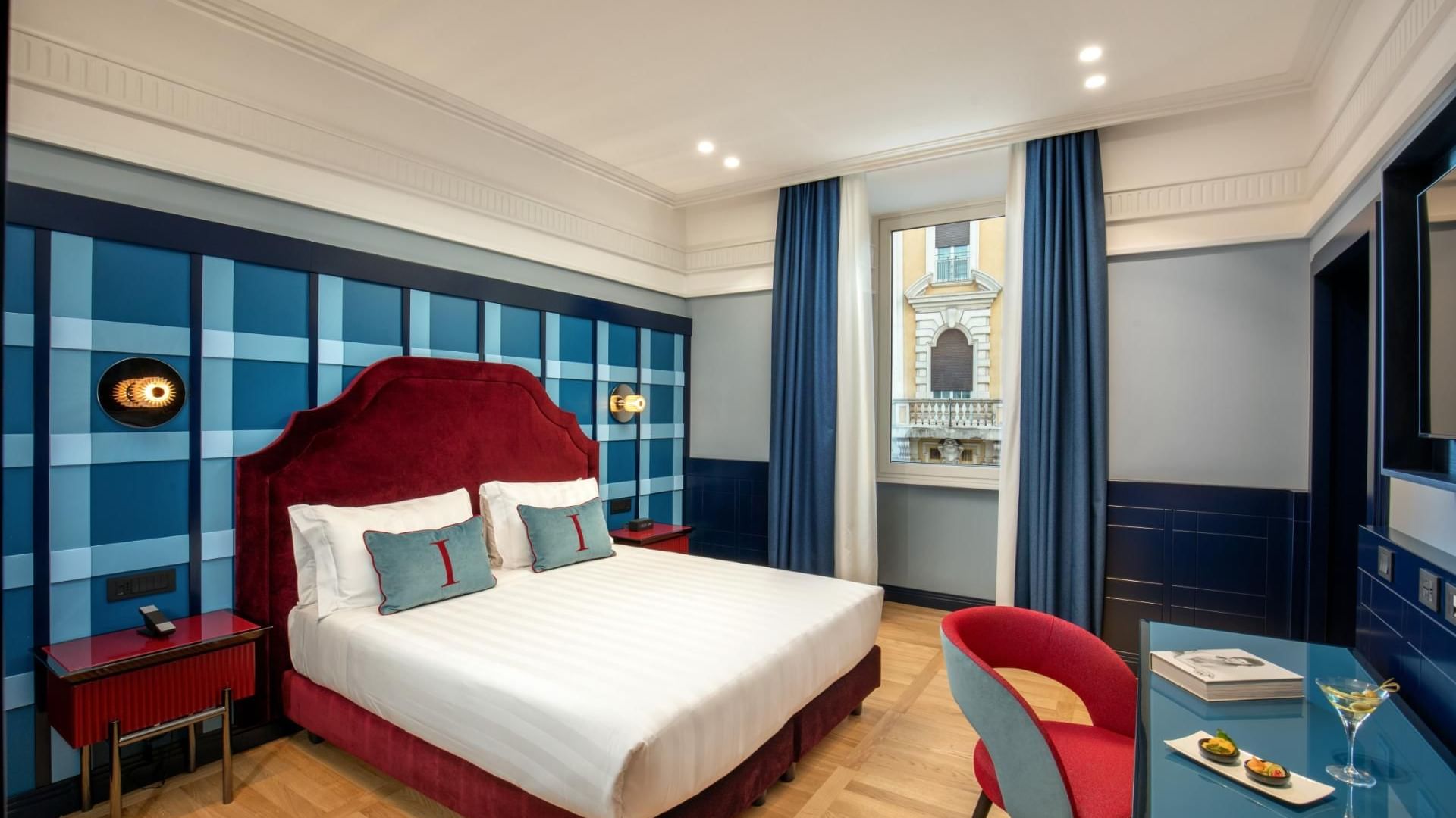 Modern Cielo Suite with stylish decor, smart bathroom entrance, and wooden floors at The Independent