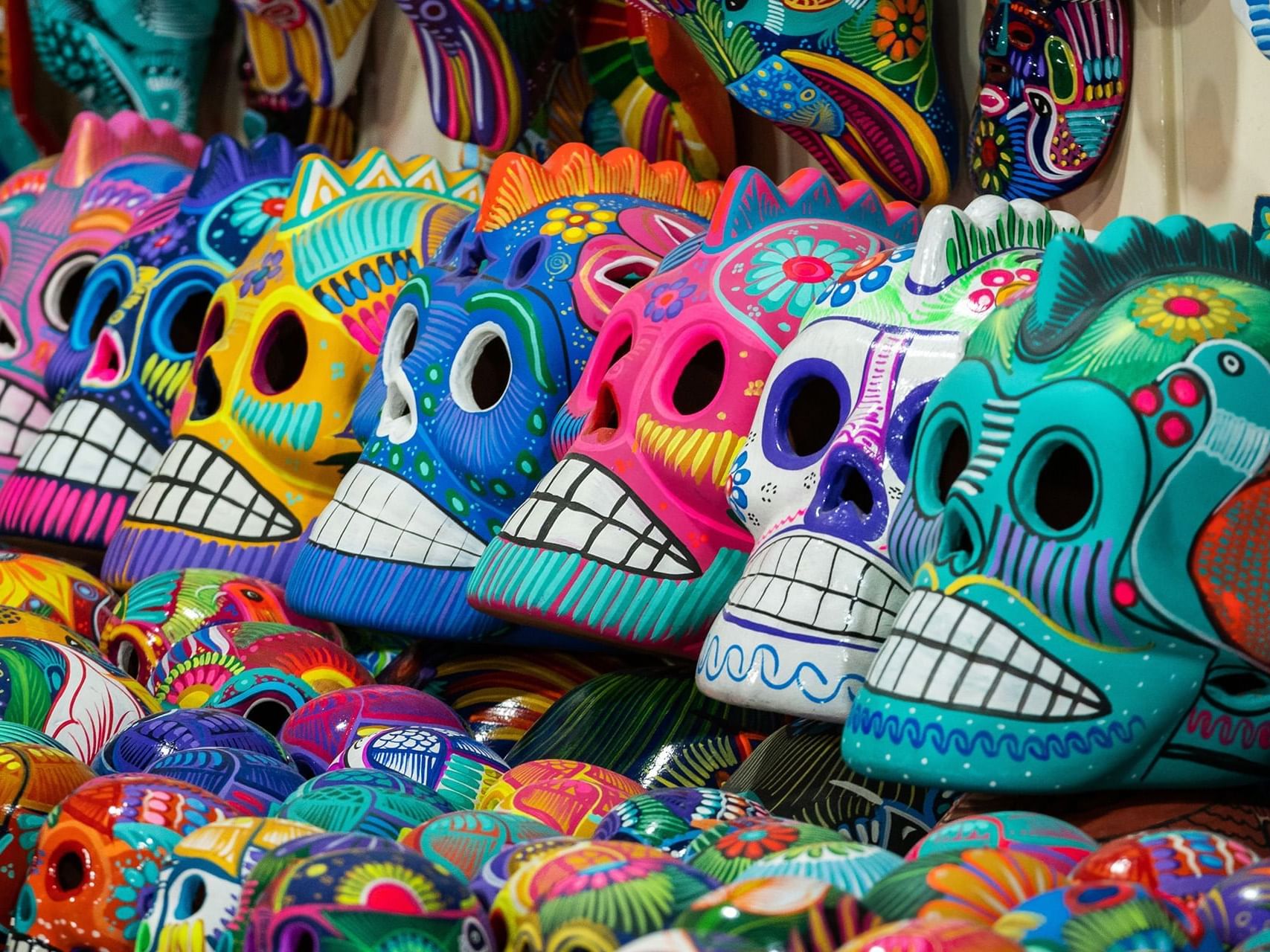 Cultural masks in a street market near La Colección Resorts