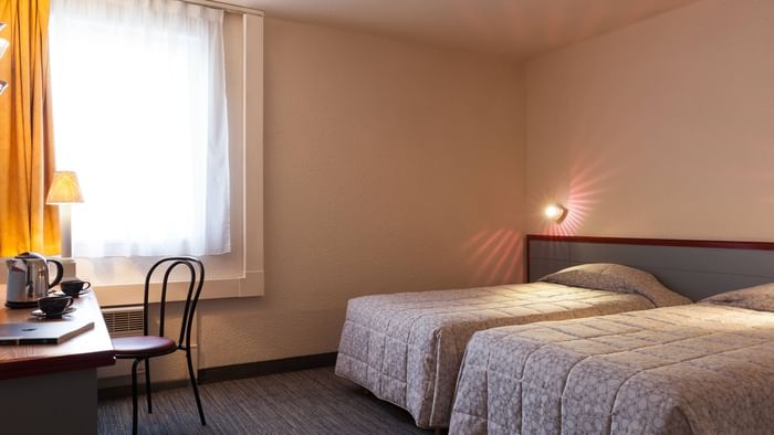 Interior of Twin Beds in Executive suite room at Le Forum