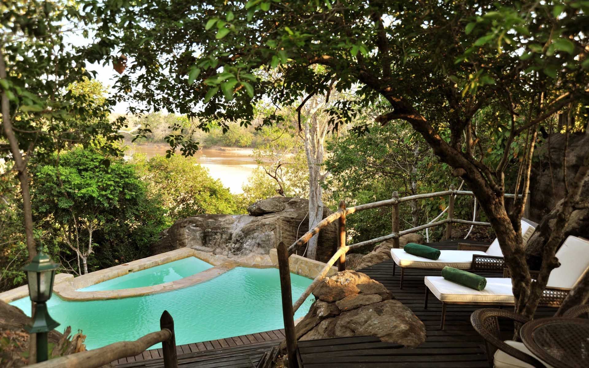 View of the hotel swimming pool at Serena Mivumo River Lodge