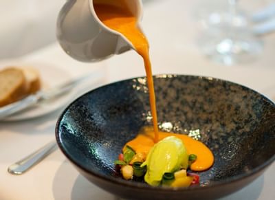 Close-up of serving tomato gazpacho soup at Hotel Sternen