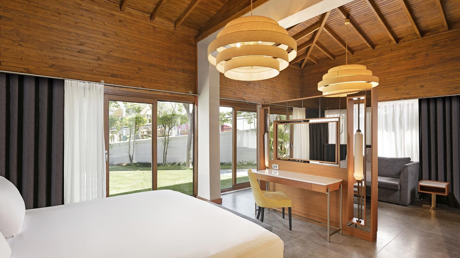 Work desk & lounge area by the bed in Bali House Garden at Titanic Deluxe Golf Belek