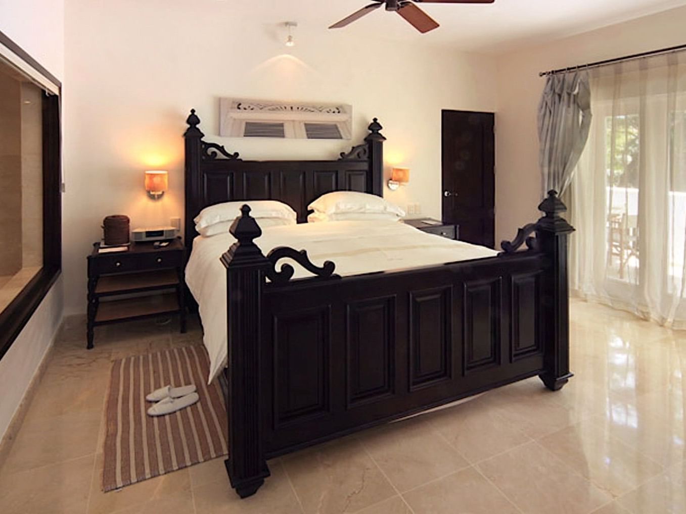 Suites bedroom with a king bed at Casa Colonial Beach and Spa
