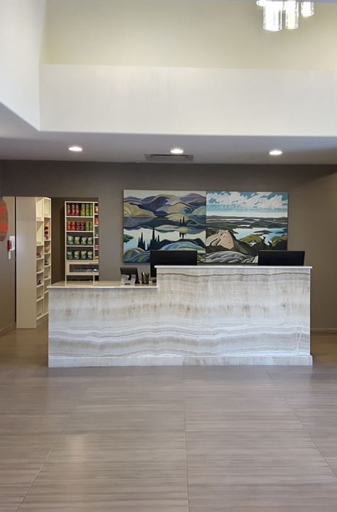 Reception area with front desk at Encore Suites Grande Prairie