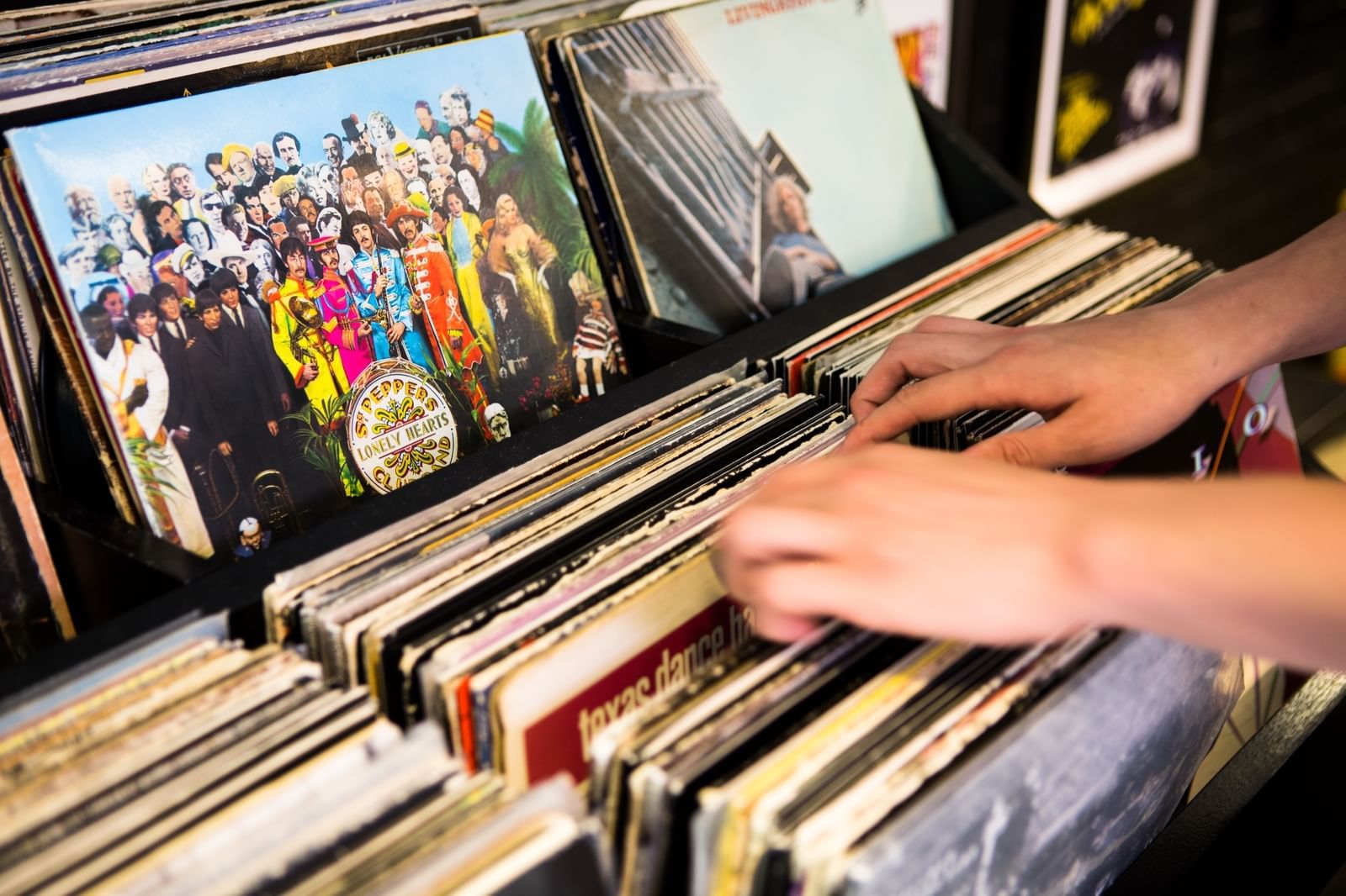 Guest going through record library at The Verb Hotel