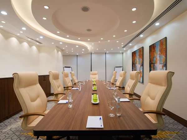 Arranged Meeting Room with a long table at Warwick Riyadh