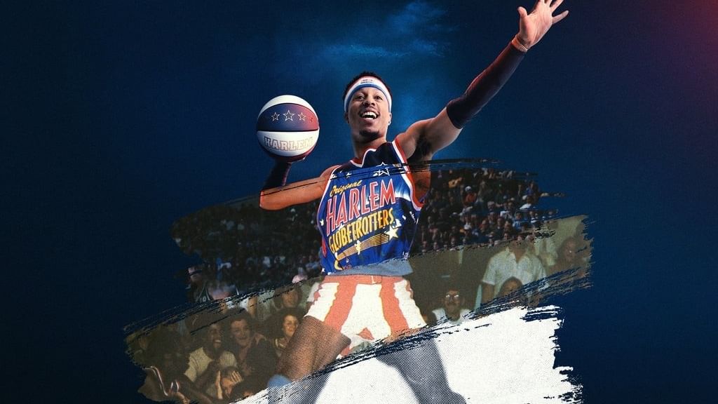 Globetrotters player holding a ball and running on court during Harlem Globetrotters 100 Year Tour 2026.
