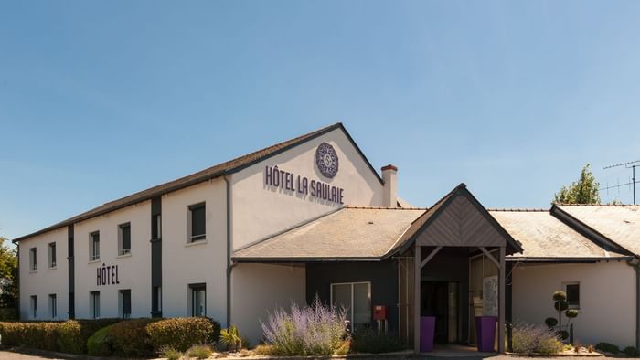 An exterior view of the Hotel & car park at Hotel La Saulaie