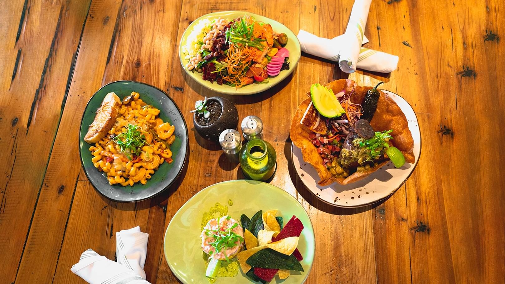 Close-up of Four plates of meals served at The Grove Hotel