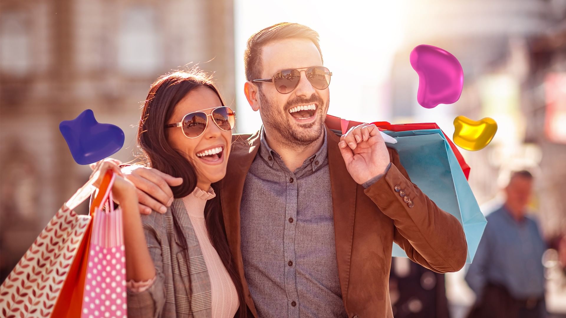 Happy couple enjoying a luxury shopping trip carrying colorful boutique bags near Quinta Real Monterrey