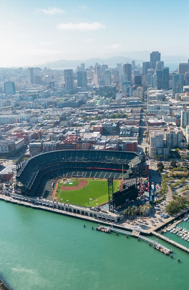 Aerial view of San Francisco city skyline, baseball stadium, and waterfront at Pickwick San Francisco