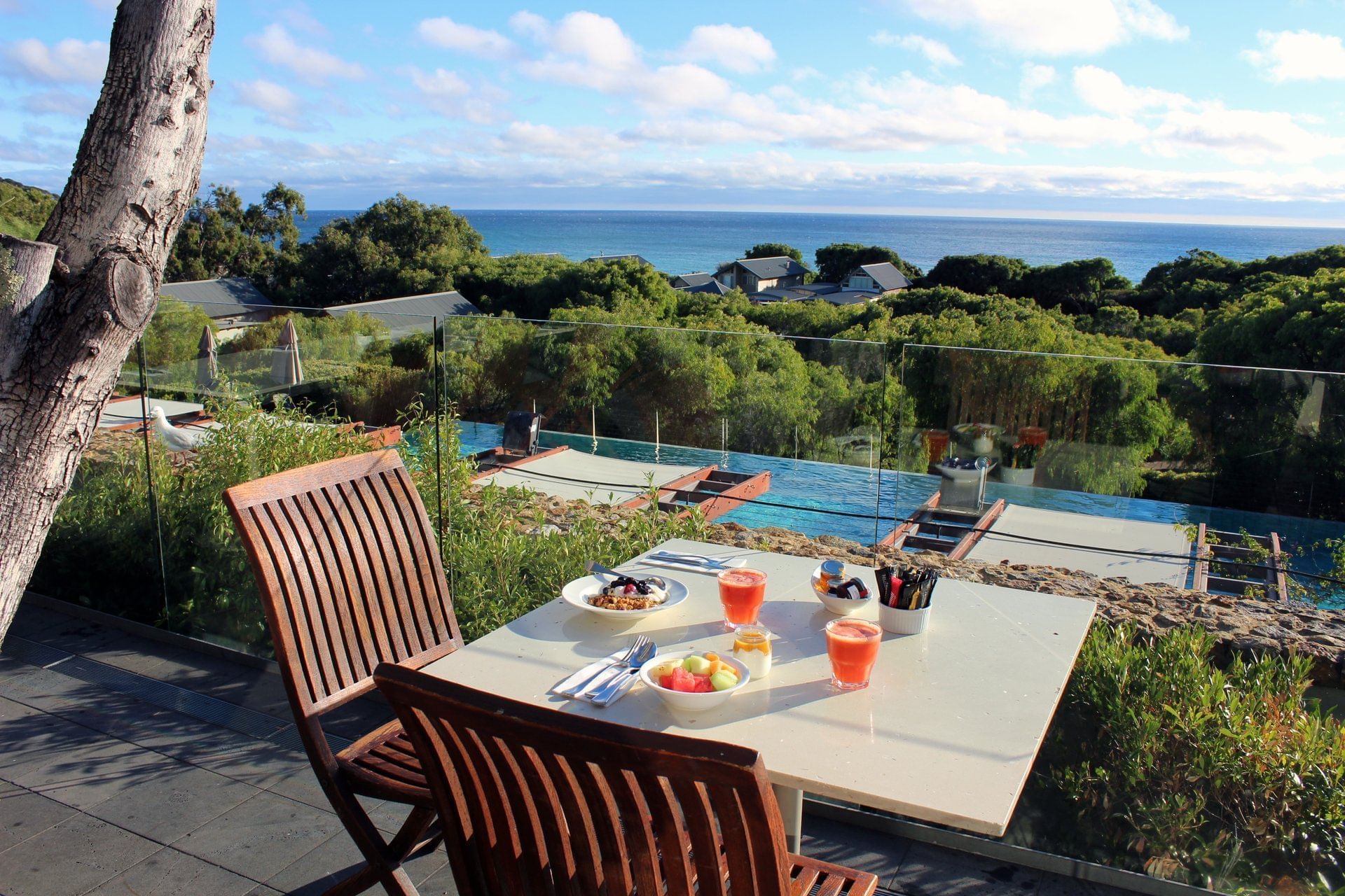 Breakfast served outdoors by pool at Pullman Bunker Bay Resort