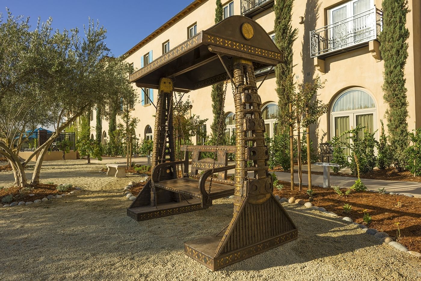 Lorem ipsum Outdoor wooden swing at Allegretto Vineyard Resort