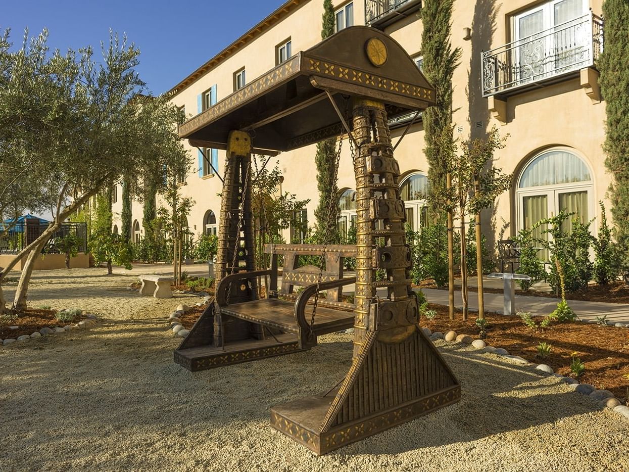 Wooden swing in the garden