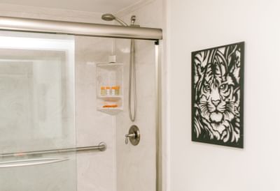 tiger picture frame next to shower