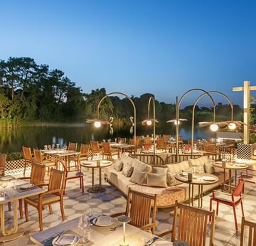 Open-air dining area with chairs and tables of Pascarella Italian Restaurant at Titanic Deluxe Golf Belek