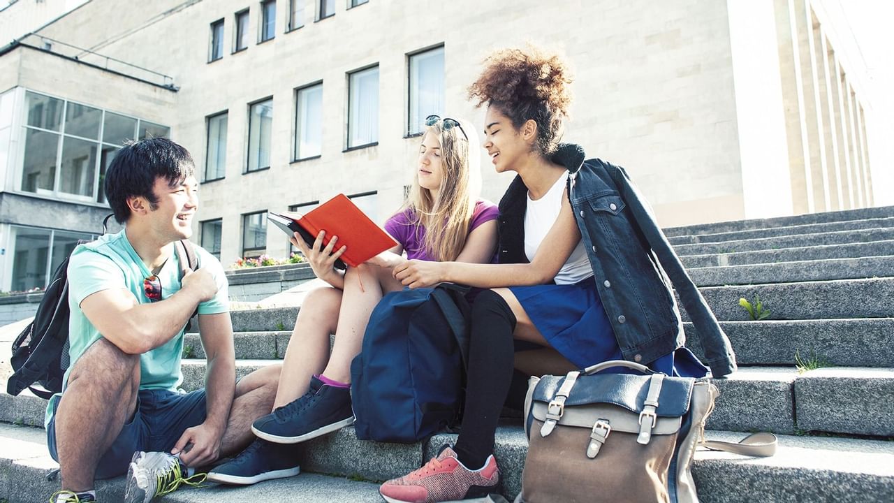 Students sitting on steps talking