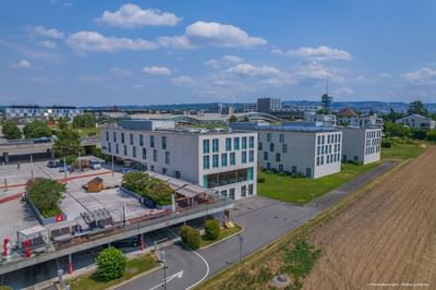 Distant view of the Starling Hotel Lausanne & city on a sunny day