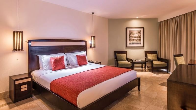 Bedroom & lounge area in Warwick Deluxe Room at Warwick Fiji