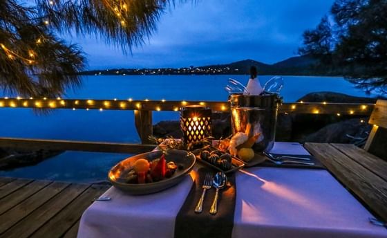 Dinning table with meals by the Bay at Freycinet Lodge