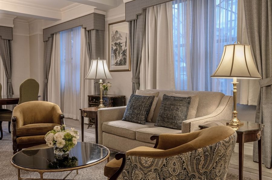 Elegant living room with couch, chairs, and coffee table at Warwick New York.