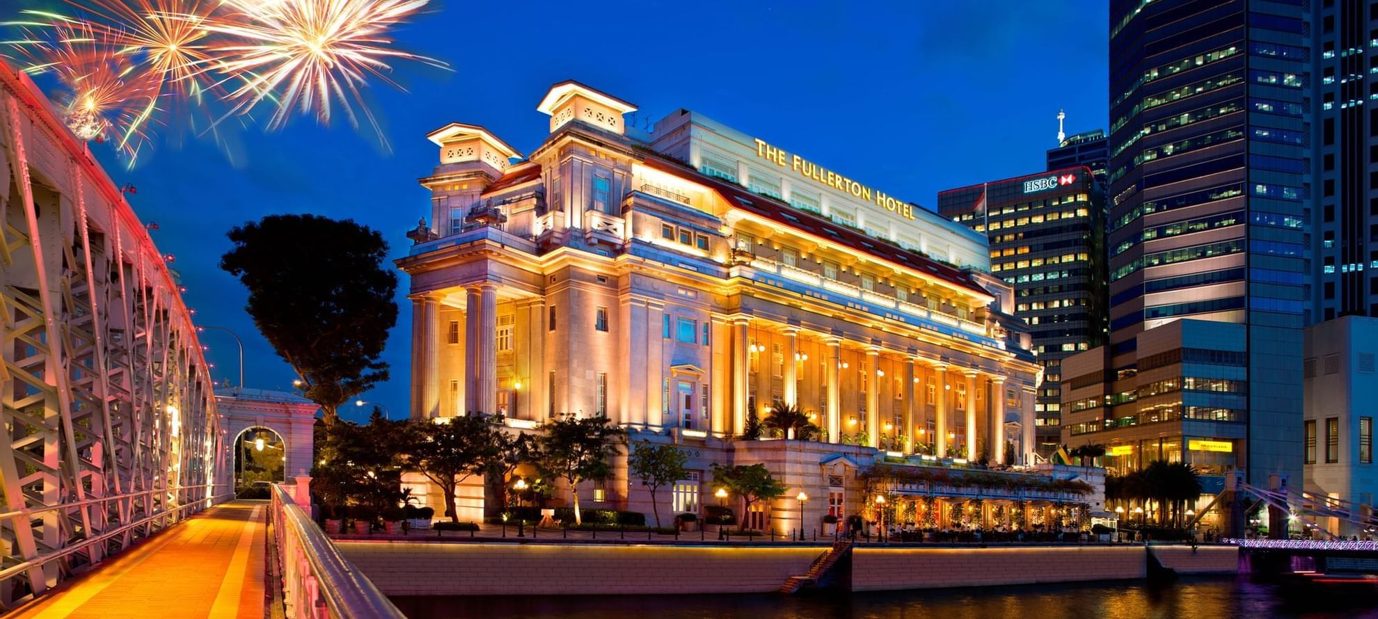 The exterior of The Fullerton Singapore with fireworks